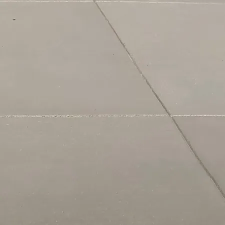Close-up of a broom-finished concrete surface