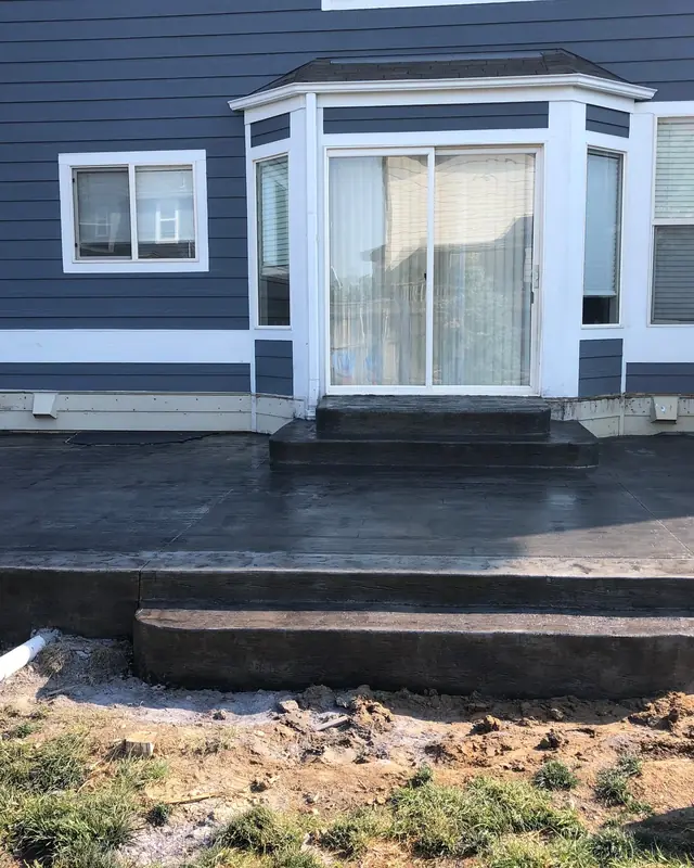 Charcoal stamped patio and step