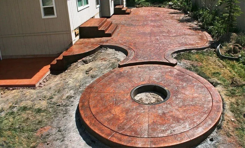 Stamped patio with a round fire pit