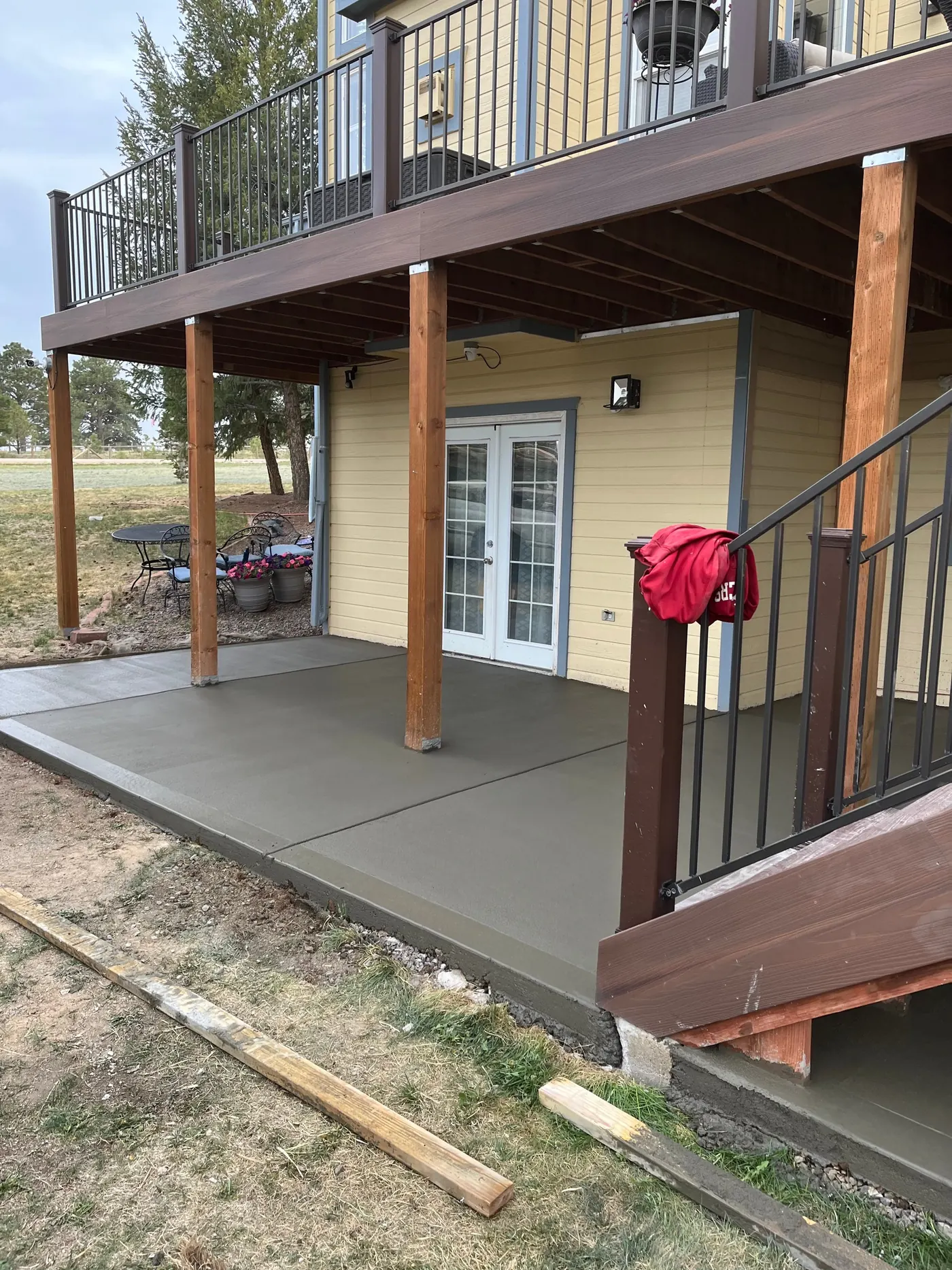 Patio slab under a deck
